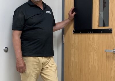 man with open window armor